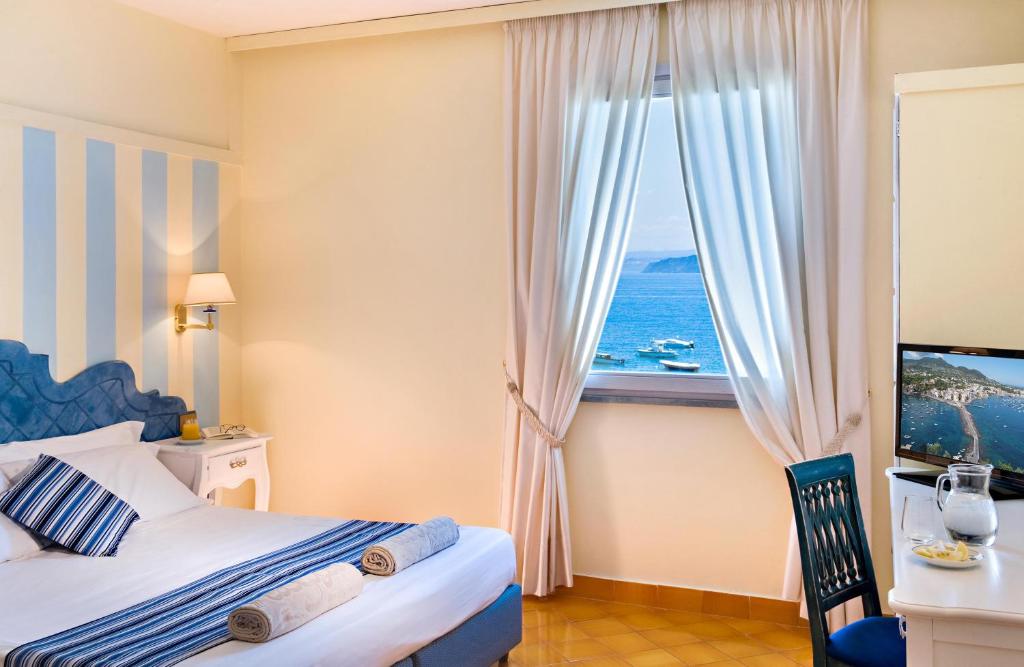 Postel nebo postele na pokoji v ubytování Hotel Mare Blu Terme