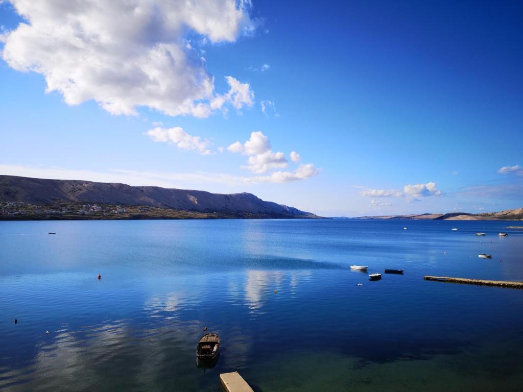 a large body of water with boats in it at Bellavista bed and breakfast in Pag