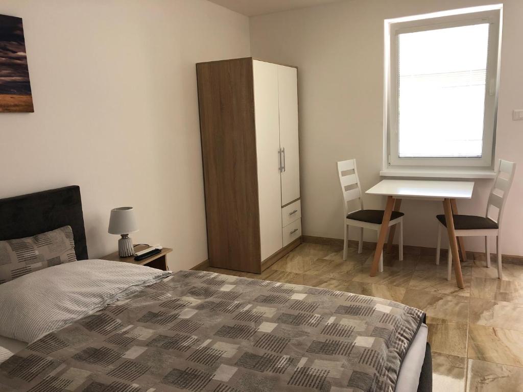 A bed or beds in a room at PODHÁJSKA 110