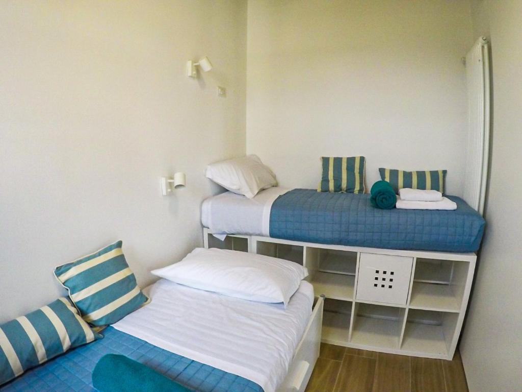 Postel nebo postele na pokoji v ubytování 7 Bridges Apartment