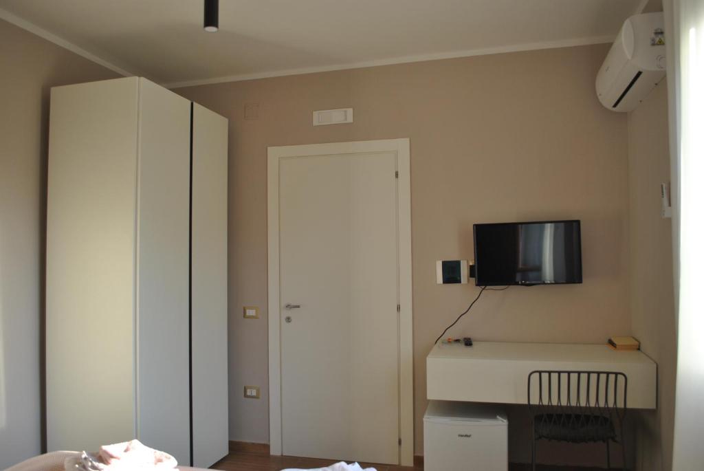 Televízia a/alebo spoločenská miestnosť v ubytovaní Puteoli house