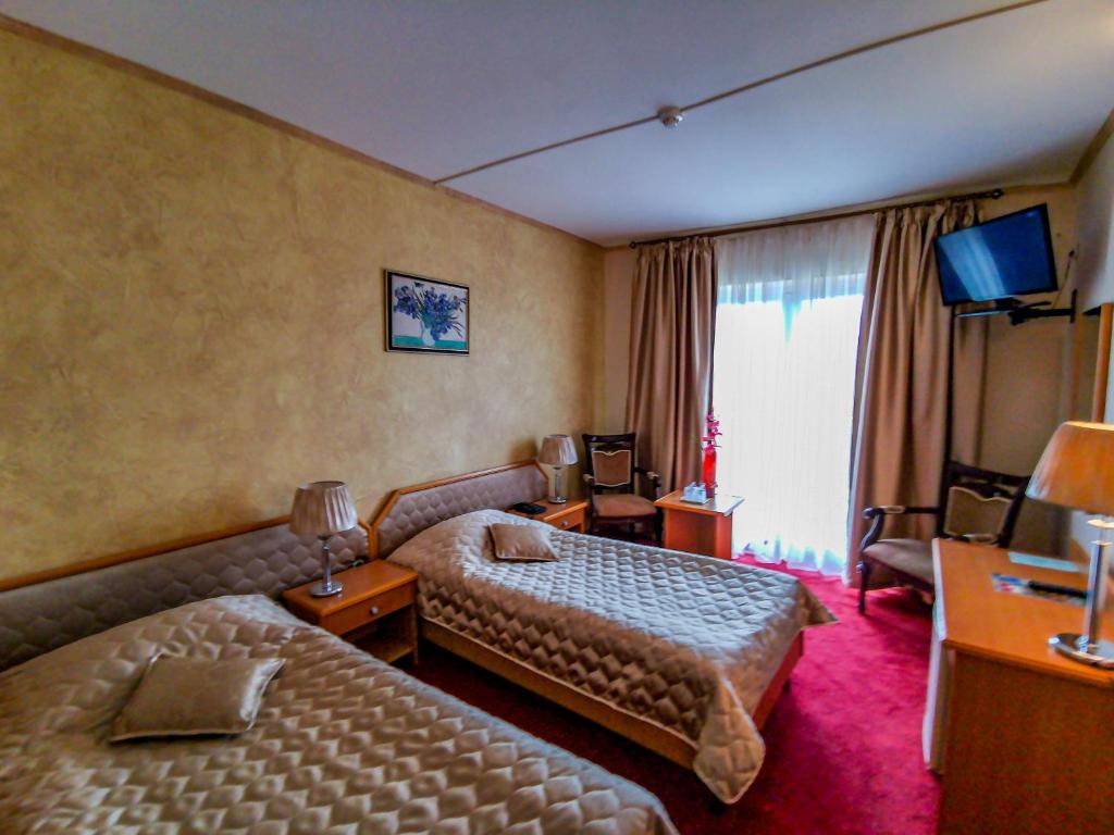Postel nebo postele na pokoji v ubytování Hotel Belvedere