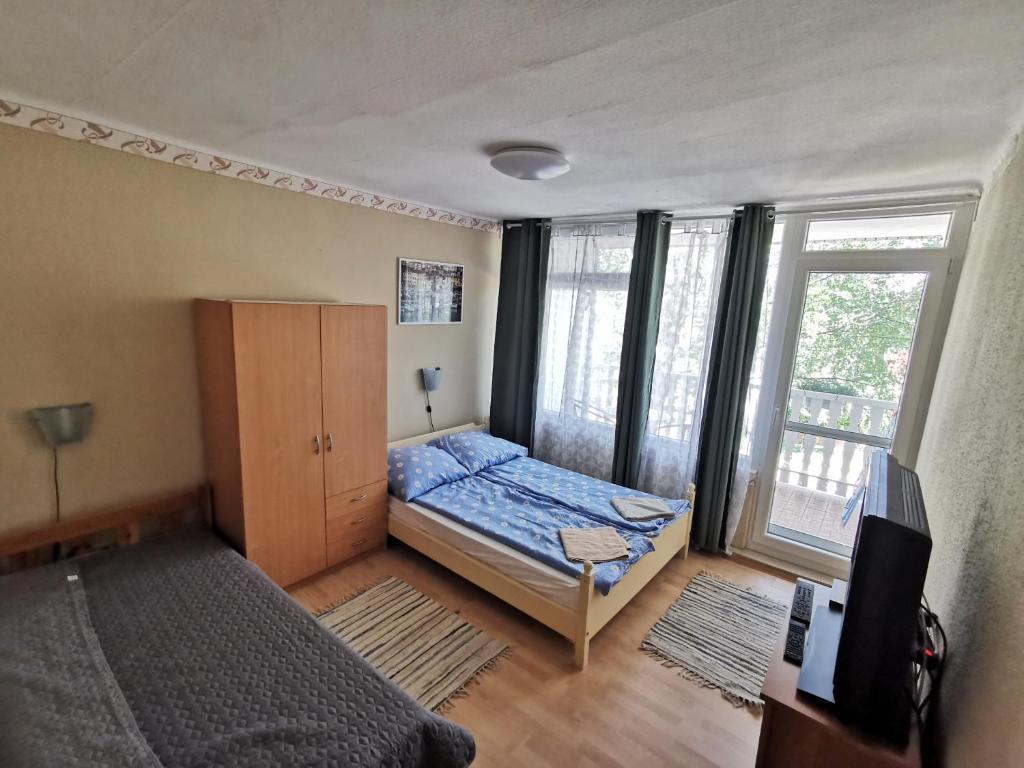 Кровать или кровати в номере Edina-ház