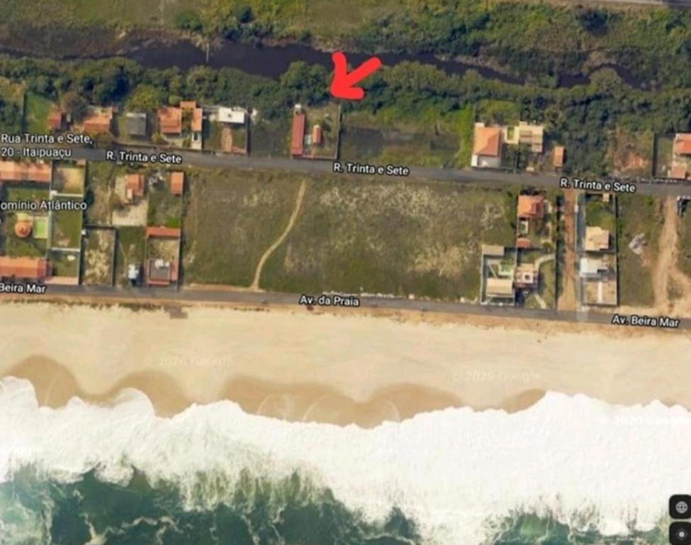 an aerial view of a beach with a red x at Pousada da Praia in Itaipuaçu