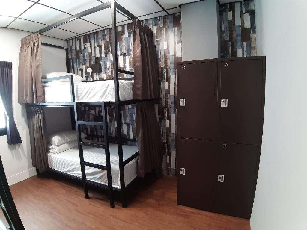 Postel nebo postele na pokoji v ubytování Quiet Hostel - Minquan Inn