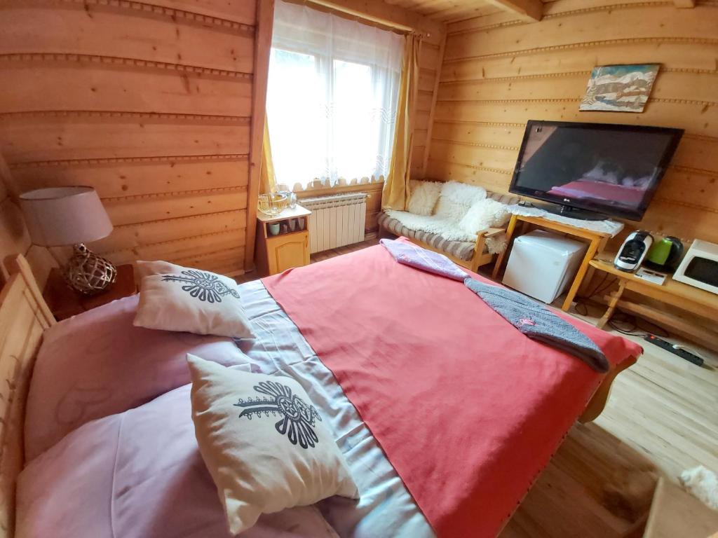 Posteľ alebo postele v izbe v ubytovaní Domek Jelonek