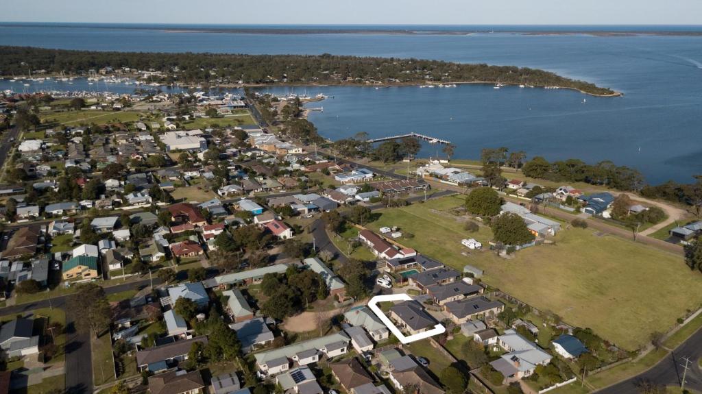 an aerial view of a town next to the water at Toonalook Retreat in Paynesville