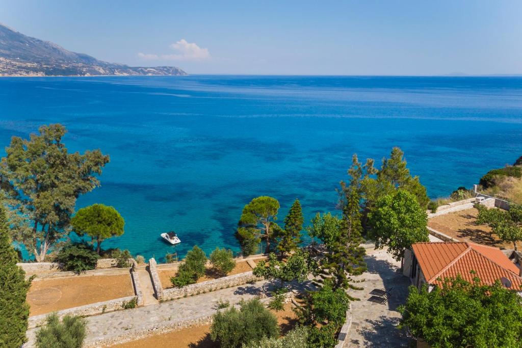 a view of the ocean from a house at Ploes Luxury Cottages in Kefallonia