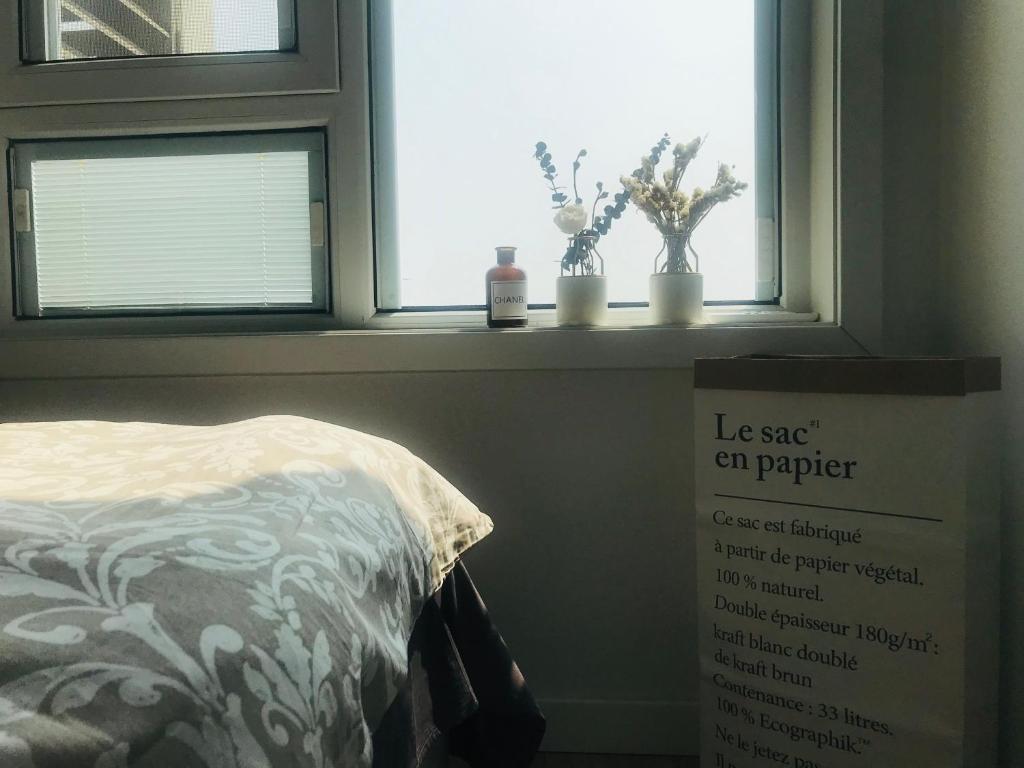 Postel nebo postele na pokoji v ubytování Zhe·Yi Boutique Guesthouse