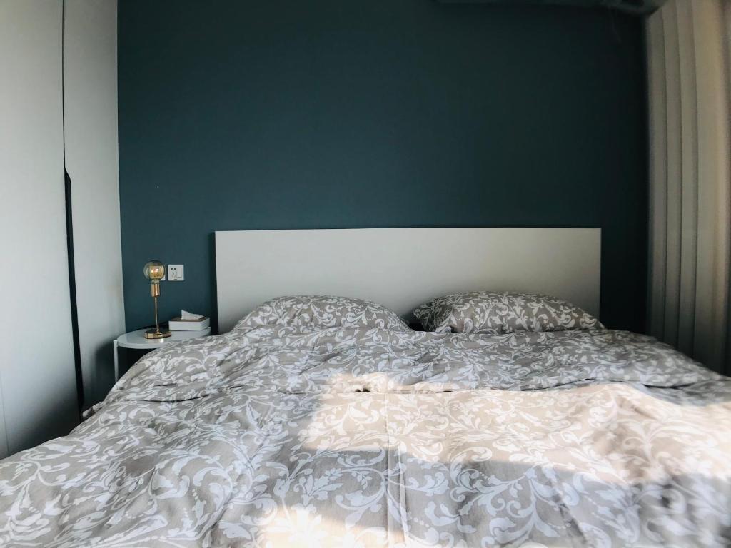 Postel nebo postele na pokoji v ubytování Zhe·Yi Boutique Guesthouse