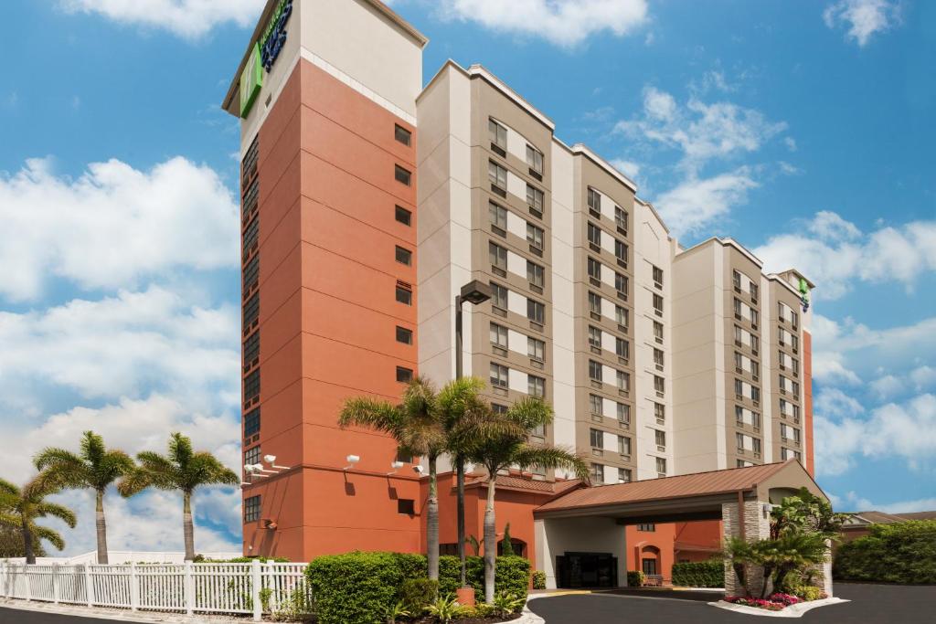 a rendering of the exterior of a hotel at Holiday Inn Express & Suites - Nearest Universal Orlando, an IHG Hotel in Orlando