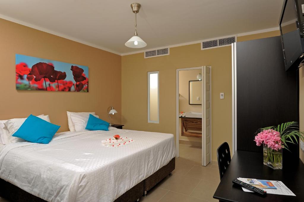 Postel nebo postele na pokoji v ubytování Eden Beach Resort - Bonaire