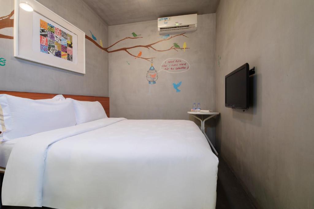 TV a/nebo společenská místnost v ubytování Shenzhen Dongmen Colour Hotel