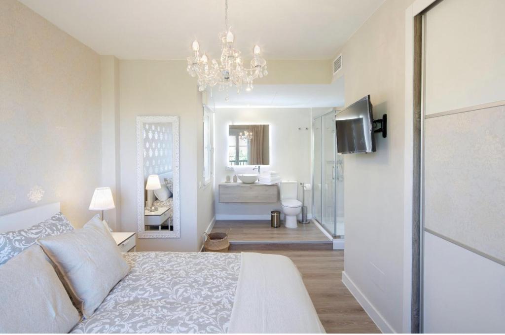 A bed or beds in a room at AMAZING DUPLEX NEXT TO THE BEACH IN MARBELLA