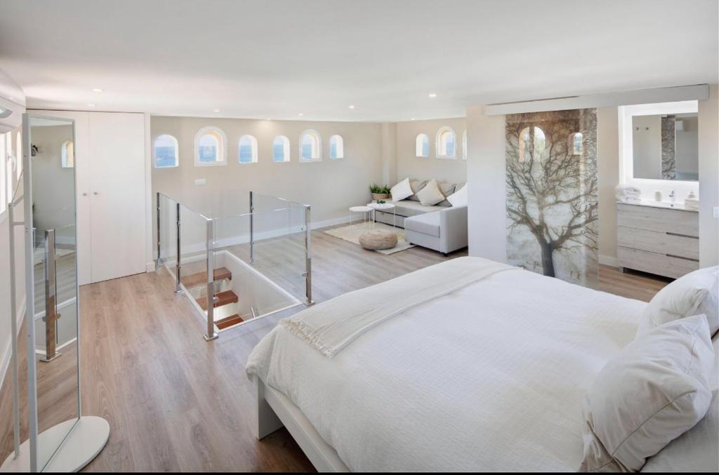 A bed or beds in a room at AMAZING DUPLEX NEXT TO THE BEACH IN MARBELLA