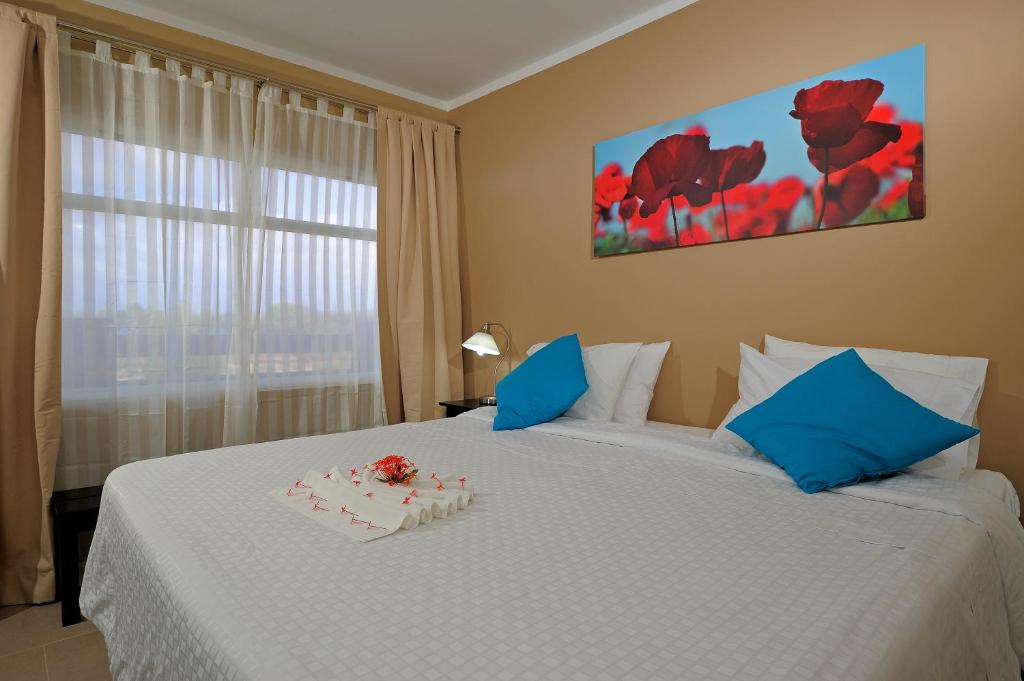 Postel nebo postele na pokoji v ubytování Eden Beach Resort - Bonaire