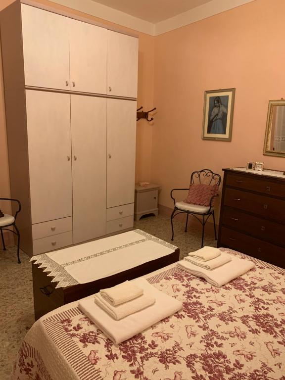 Posteľ alebo postele v izbe v ubytovaní Casa del Capitano Rocca d'Orcia