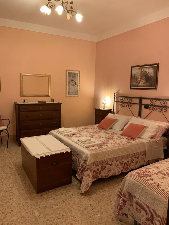 Posteľ alebo postele v izbe v ubytovaní Casa del Capitano Rocca d'Orcia