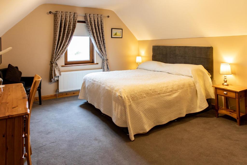 Postel nebo postele na pokoji v ubytování Twin Peaks B&B