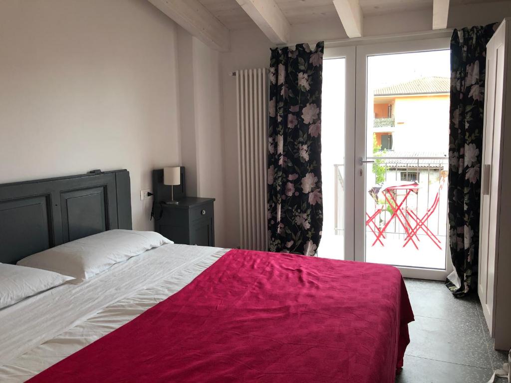 Letto o letti in una camera di B&B Corte del Garda