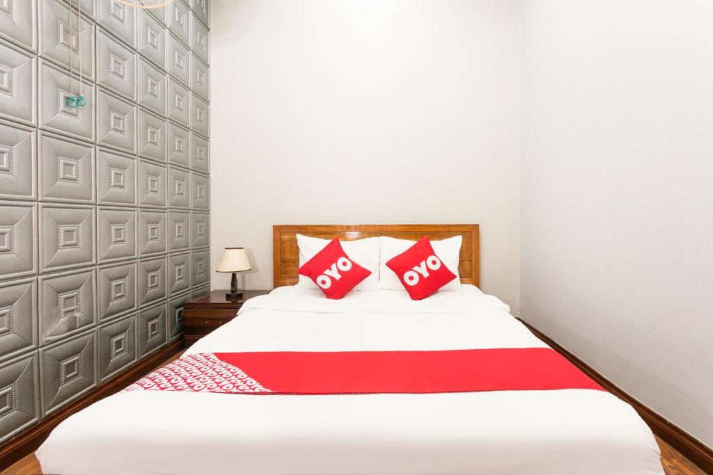 Postel nebo postele na pokoji v ubytování Honey Hotel Da Nang