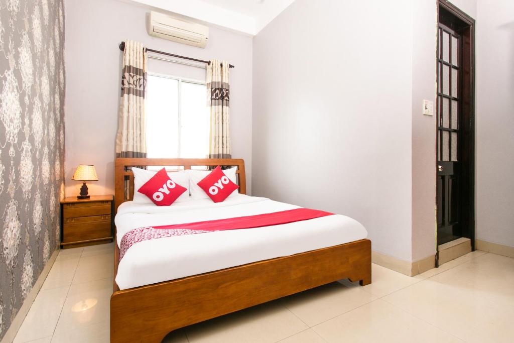 Postel nebo postele na pokoji v ubytování Honey Hotel Da Nang
