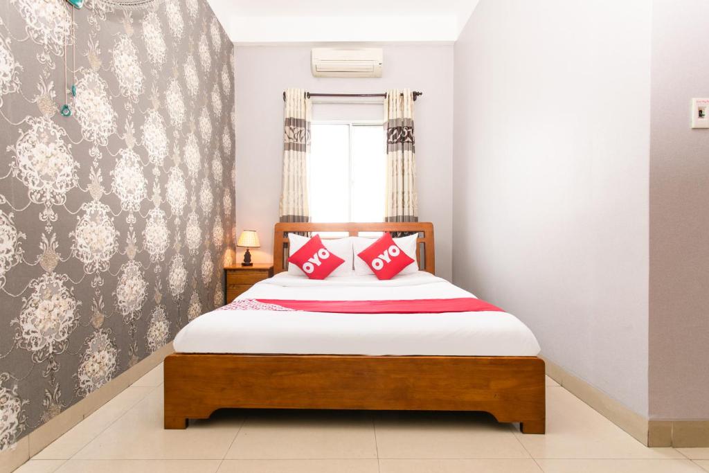Postel nebo postele na pokoji v ubytování Honey Hotel Da Nang