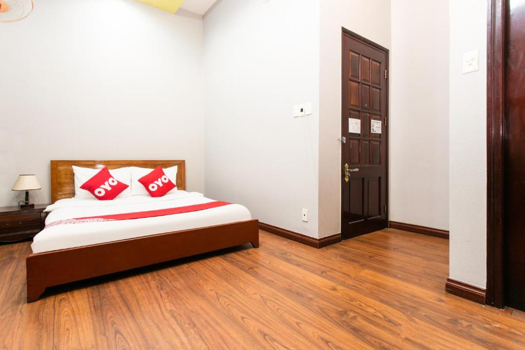 Postel nebo postele na pokoji v ubytování Honey Hotel Da Nang