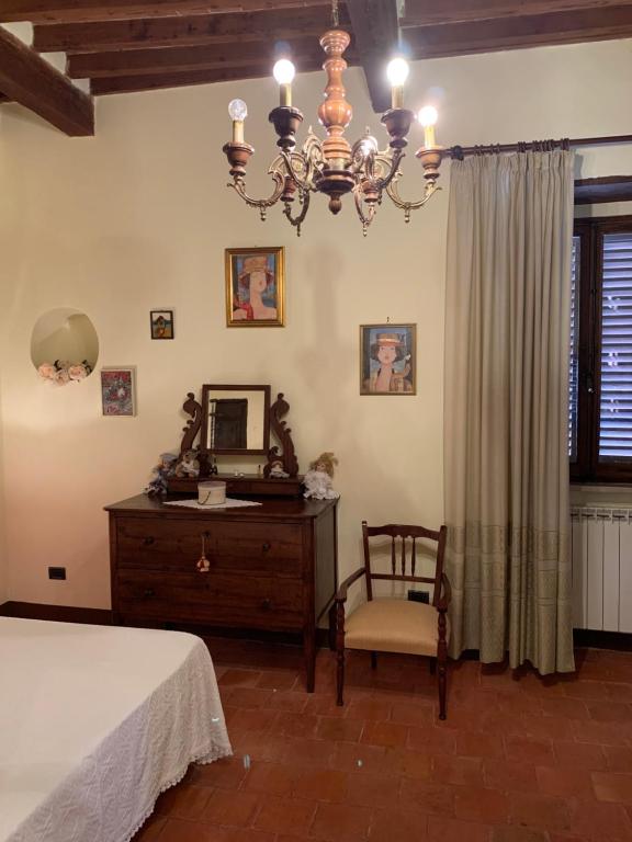 Posteľ alebo postele v izbe v ubytovaní Casa del Capitano Rocca d'Orcia