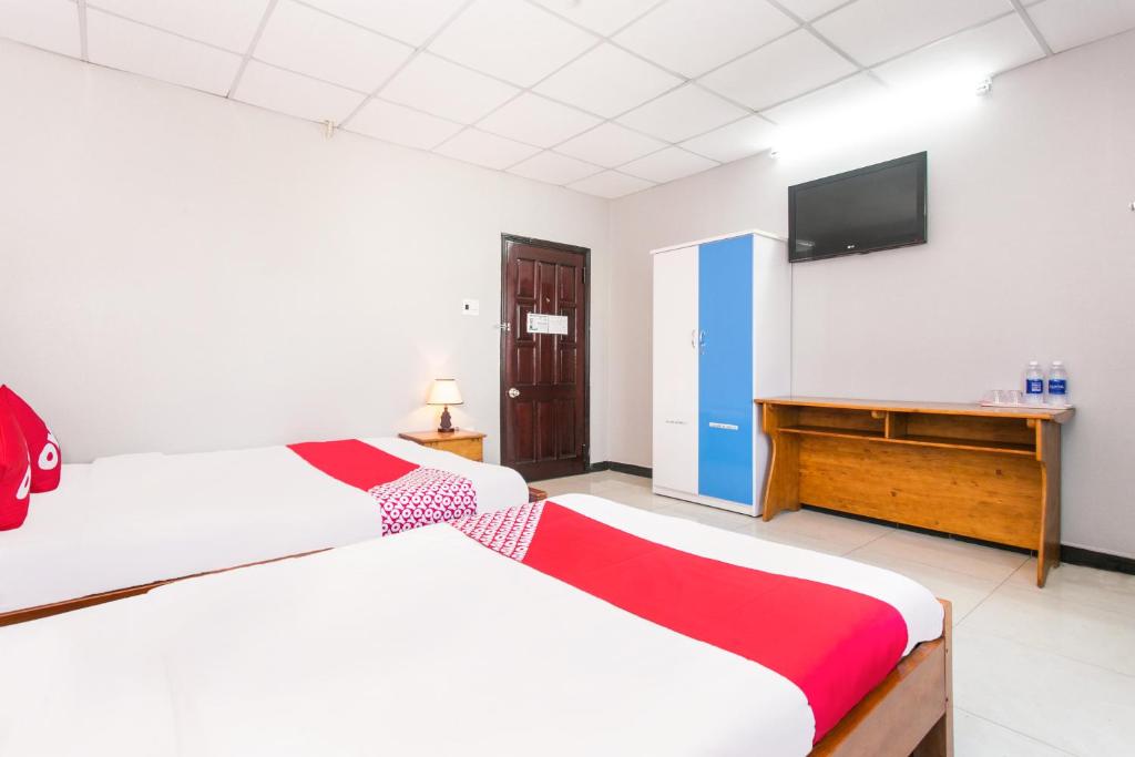 Postel nebo postele na pokoji v ubytování Honey Hotel Da Nang