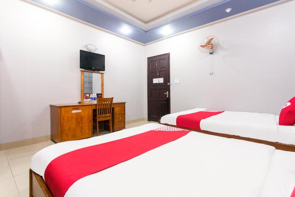 Postel nebo postele na pokoji v ubytování Honey Hotel Da Nang