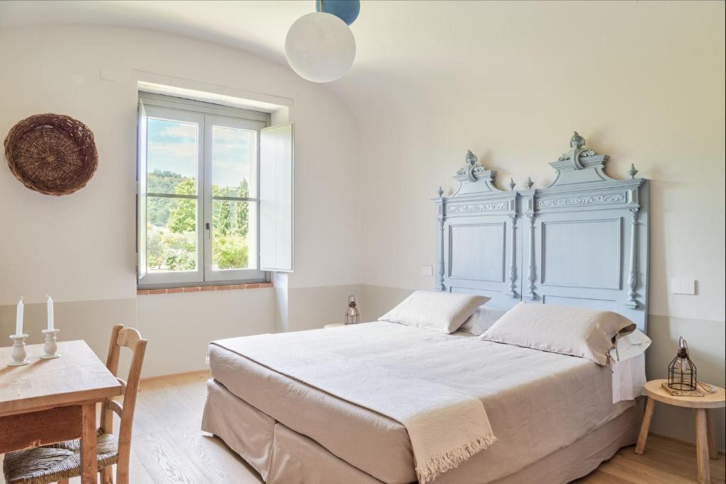 Postel nebo postele na pokoji v ubytování CUGUSI BnB