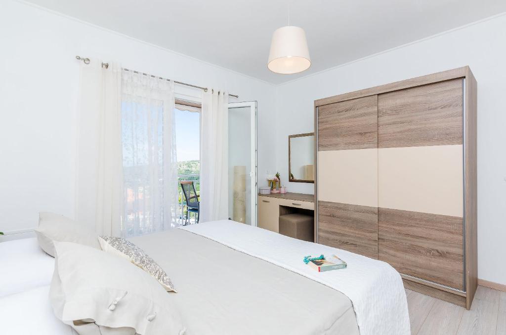 Posteľ alebo postele v izbe v ubytovaní Adriatic Sunny Apartments