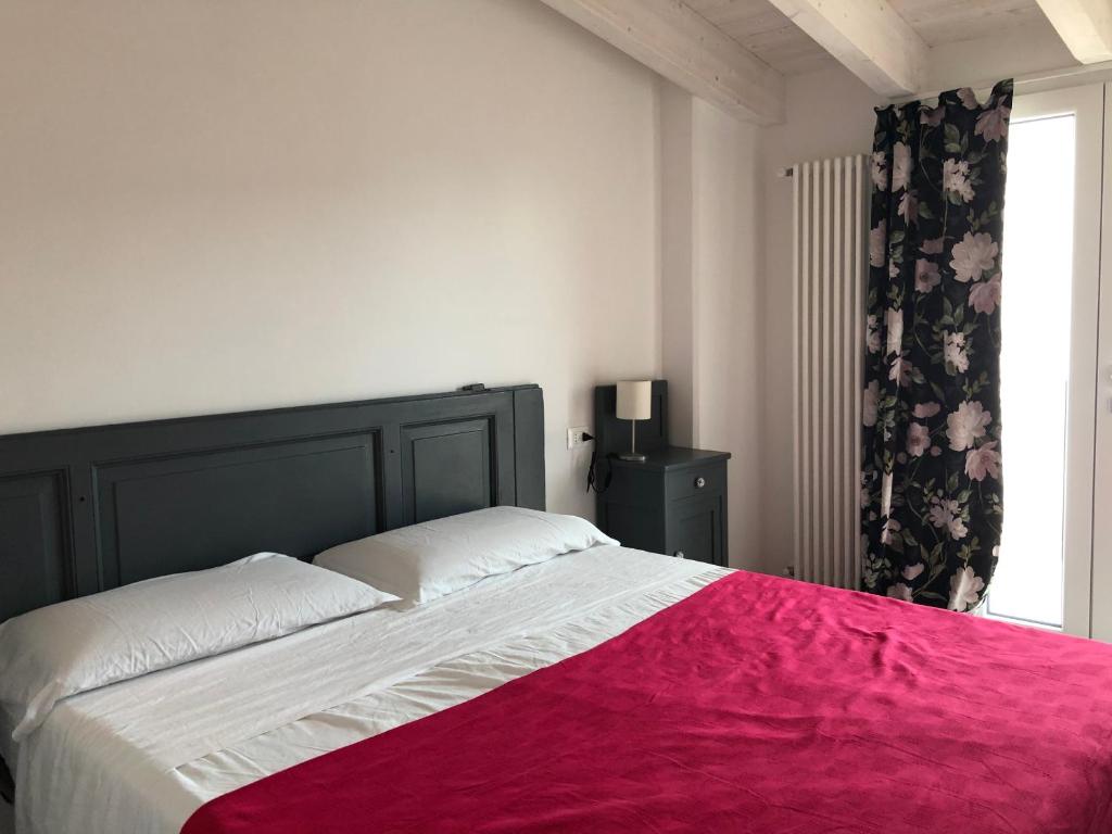 Łóżko lub łóżka w pokoju w obiekcie Corte del Garda Home