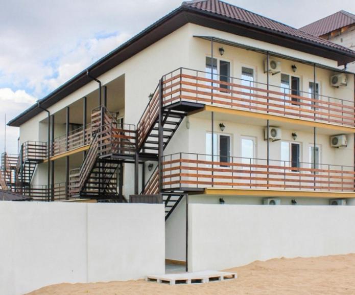 a building with stairs on the side of it at Mirage Hotel in Zatoka