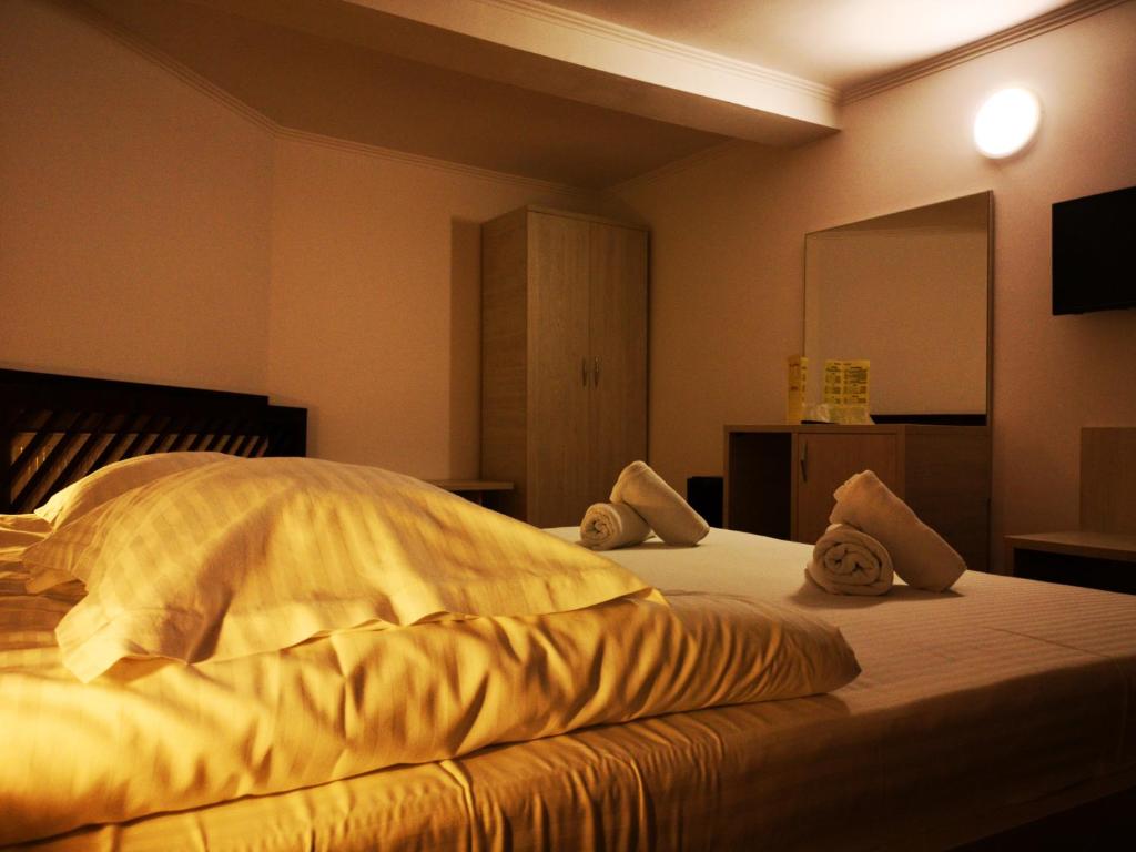 Postel nebo postele na pokoji v ubytování Casa Ardeleana