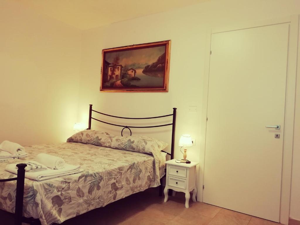 Postel nebo postele na pokoji v ubytování Le mille e una notte