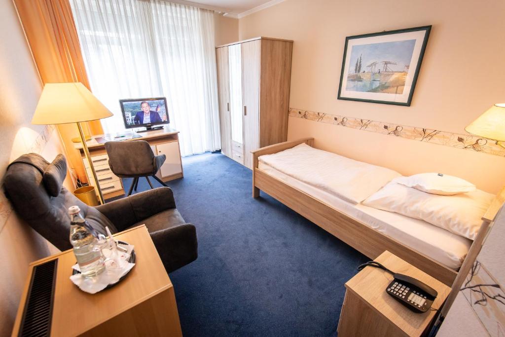 Postel nebo postele na pokoji v ubytování Hotel Krupp