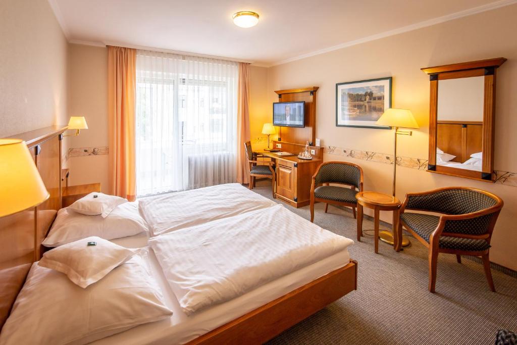 Postel nebo postele na pokoji v ubytování Hotel Krupp