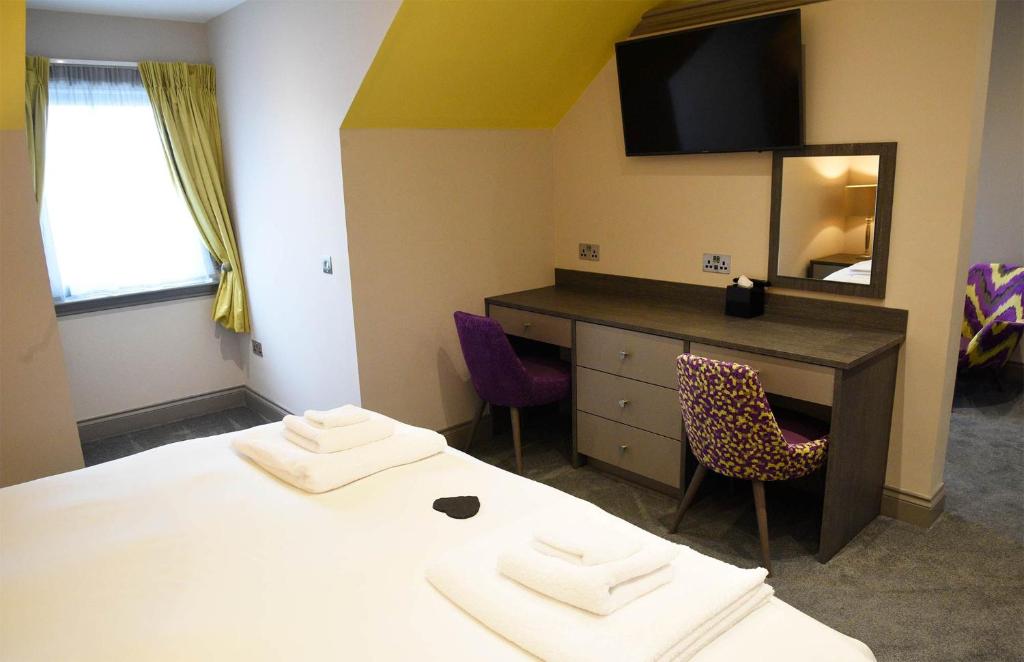Postel nebo postele na pokoji v ubytování Taransay House, Small Hotel
