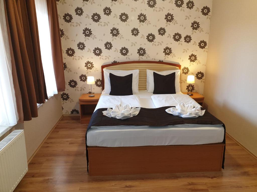 Postel nebo postele na pokoji v ubytování Six Inn Hotel Budapest