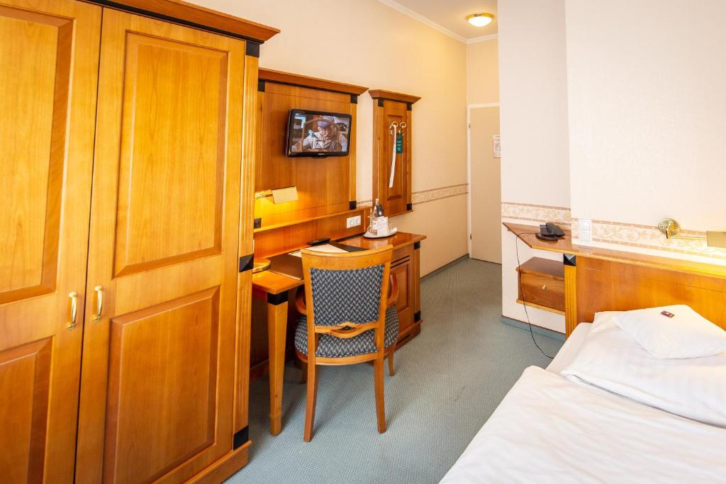 Postel nebo postele na pokoji v ubytování Hotel Krupp