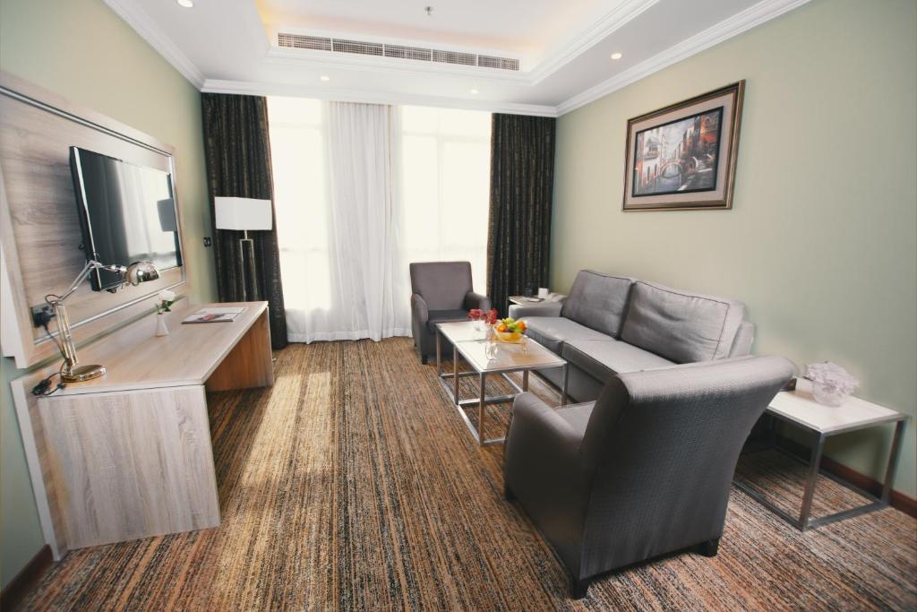 TV a/nebo společenská místnost v ubytování Iridium 70 Hotel