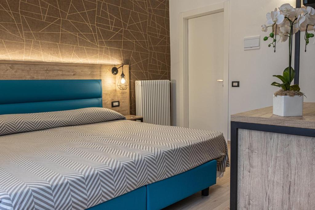 Postel nebo postele na pokoji v ubytování Cuneo Hotel