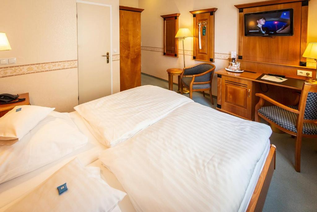 Postel nebo postele na pokoji v ubytování Hotel Krupp