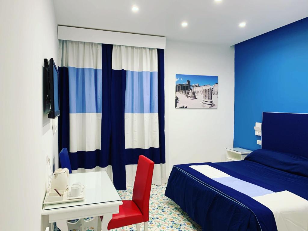 Postel nebo postele na pokoji v ubytování Hotel Metropole