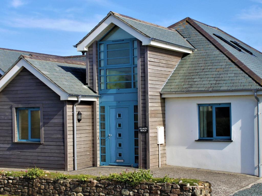 a house with a blue door at Atlantic Reach in Bude