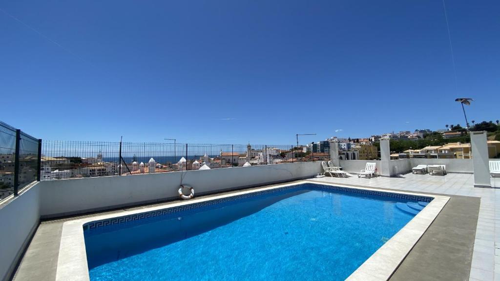 a swimming pool on the roof of a building at Rooftop - Perto da Praia - 6 Pax - Albufeira in Albufeira