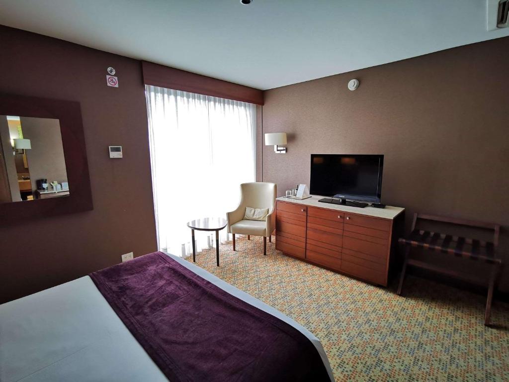 Postel nebo postele na pokoji v ubytování Mercure Bogota Calle 100
