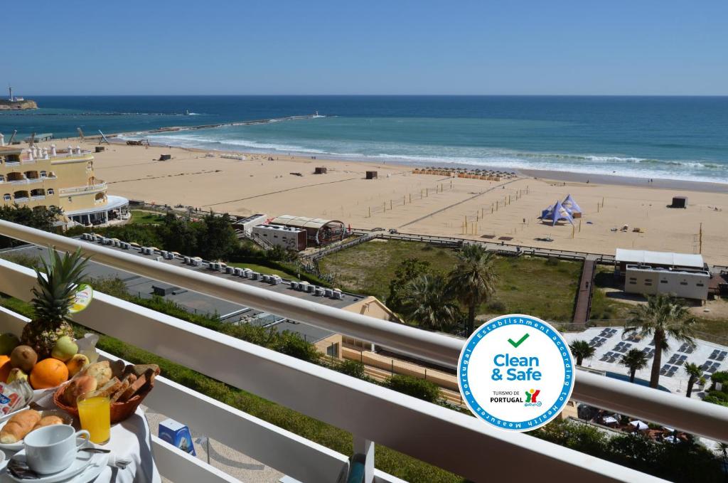 
a beach with a view of the ocean at Hotel Santa Catarina Algarve in Portimão

